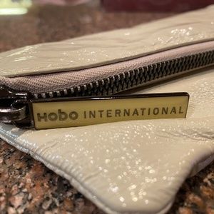 HOBO INTERNATIONAL BONE PATENT LEATHER CLUTCH